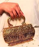 Devyani golden clutch